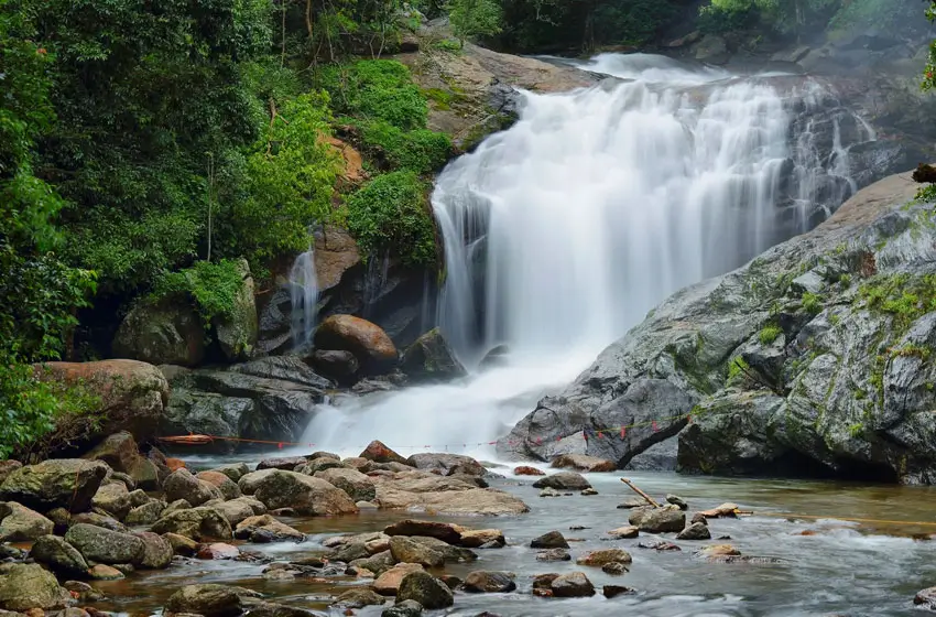 Aruvikkuzhi waterfalls cascading rocks and pool