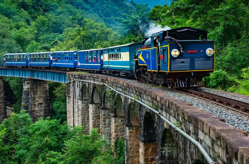 nilgiri mountain railway train on viaduct bridge